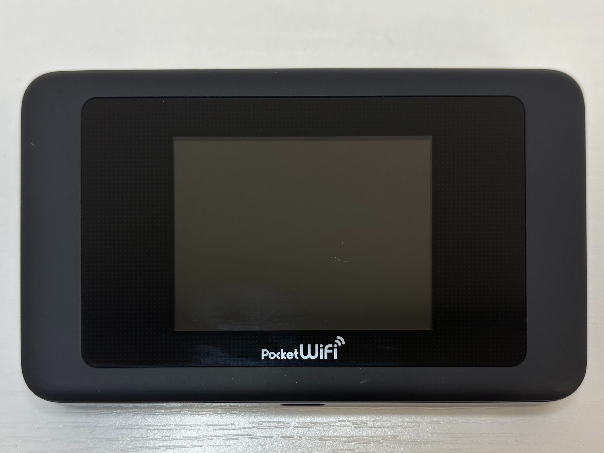 eConnect Japan Pocket WiFi router with the screen off, before it is switched on